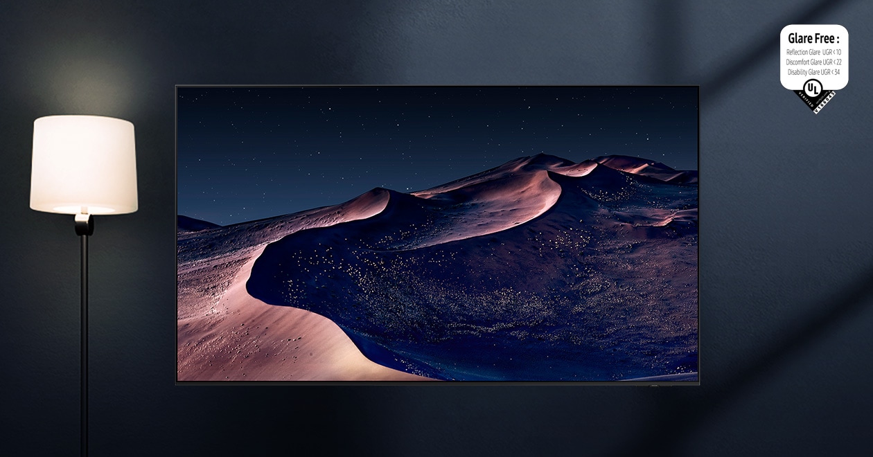 An OLED TV displays a scene of a desert on a starry night. A nearby lamp throws distracting reflections on the screen. With glare-free TV technology, the screen becomes clear. UL Verified Logo. Glare Free: Reflection Glare UGR < 10, Discomfort Glare < UGR 22, Disability Glare < 34. verifyUL.com®. V166045.